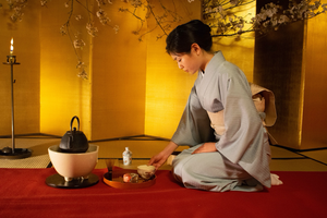 japanese woman who is serving tea at tea ceremony